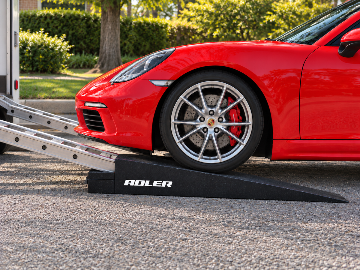 TRR3 trailer approach ramp beneath a red sports car, meeting a steeper trailer loading track.